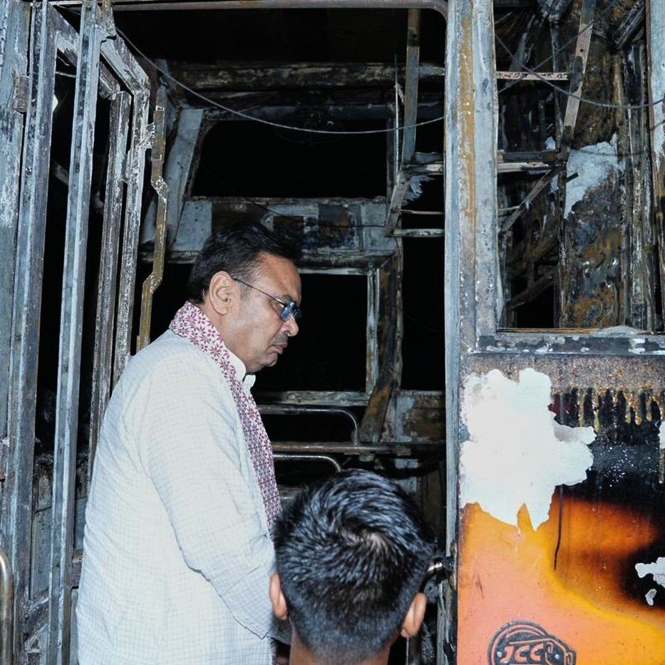 A passenger bus in northern India catches fire and burns at least 20 people to death